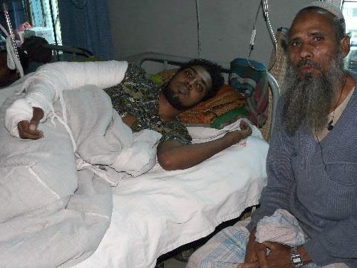 Miraj (l) and his father at the hospital