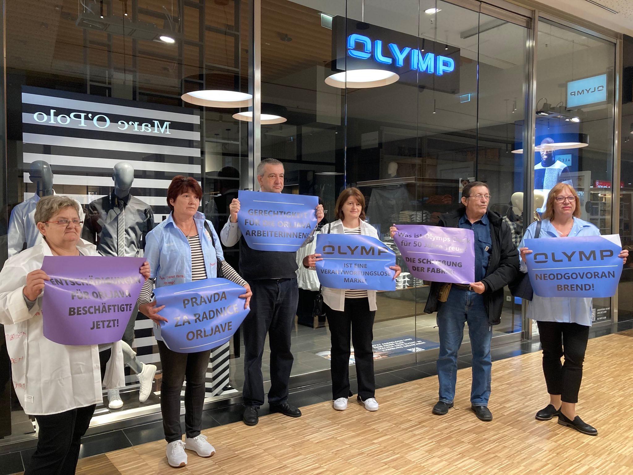 Orljava workers and trade unionists protesting in front of an Olymp store in Berlin